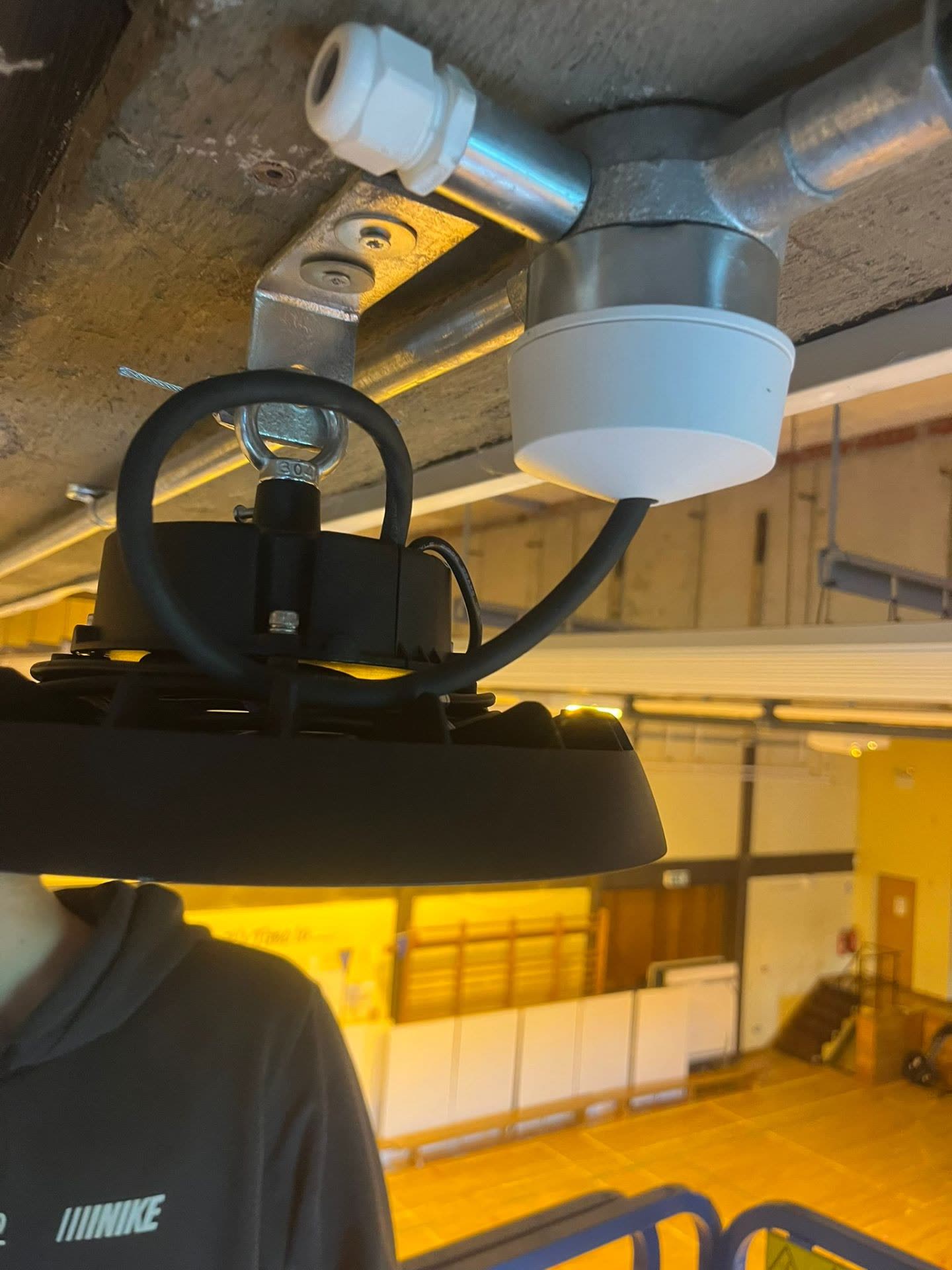 LED high bay light installation in progress