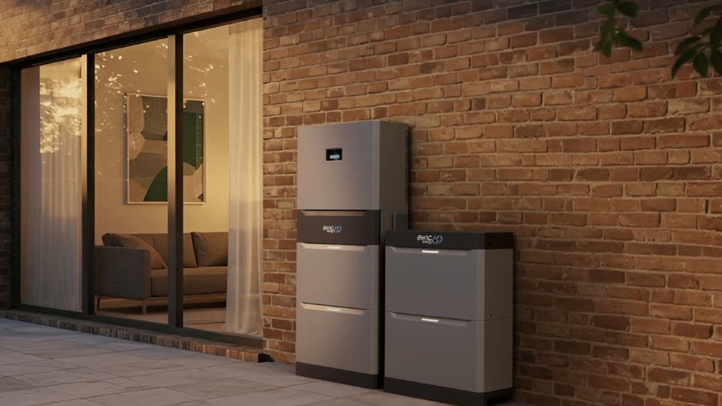 BG Sync battery storage units installed on exterior wall of modern home