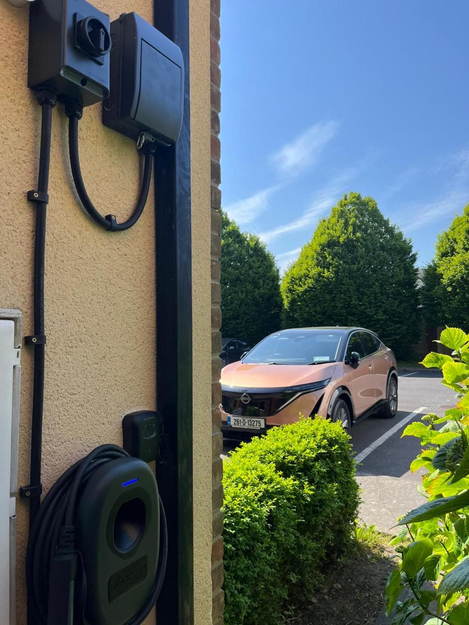 Sync EV charger with Nissan Ariya parked nearby