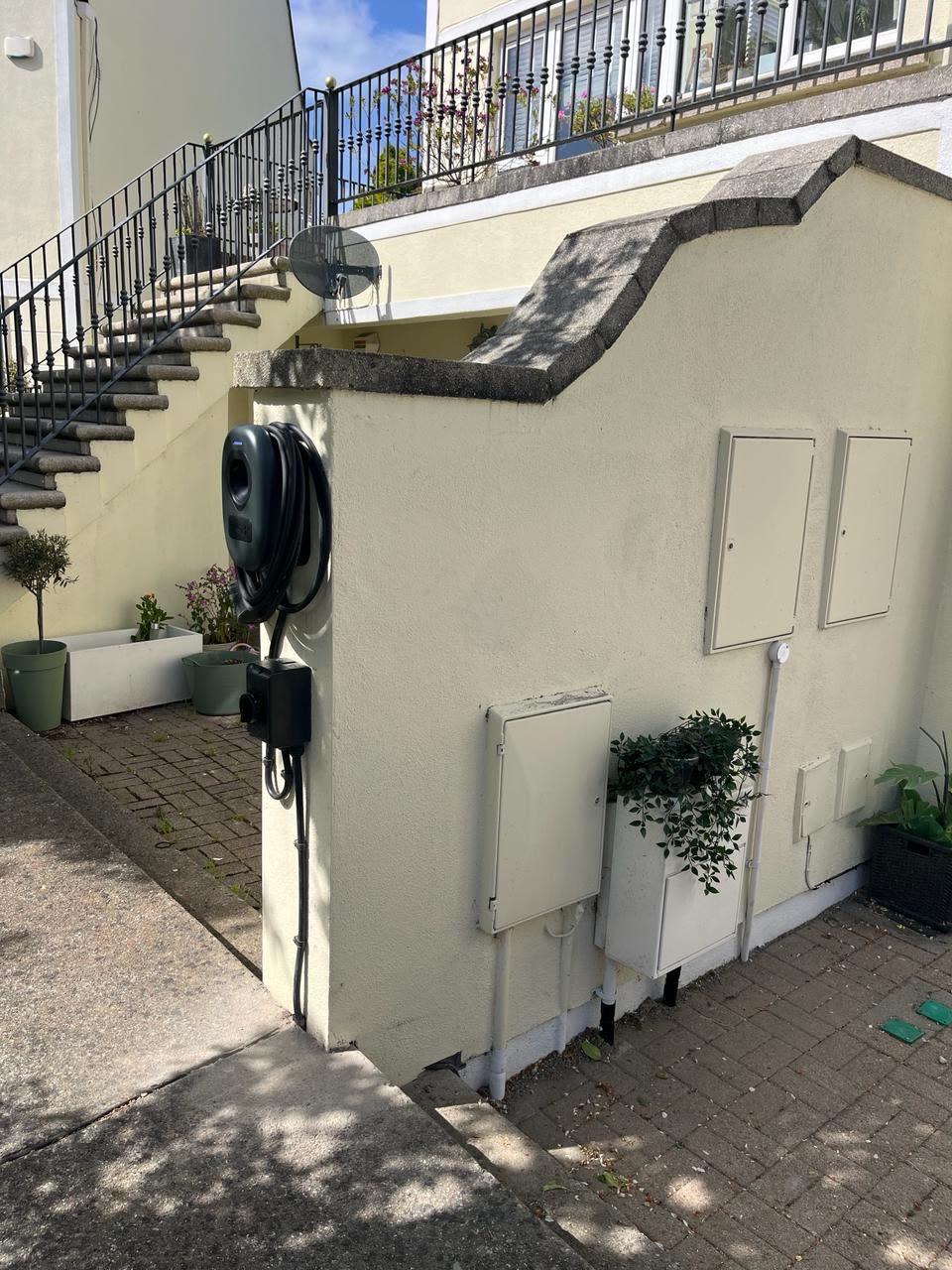 EV charger installation beside exterior stairs