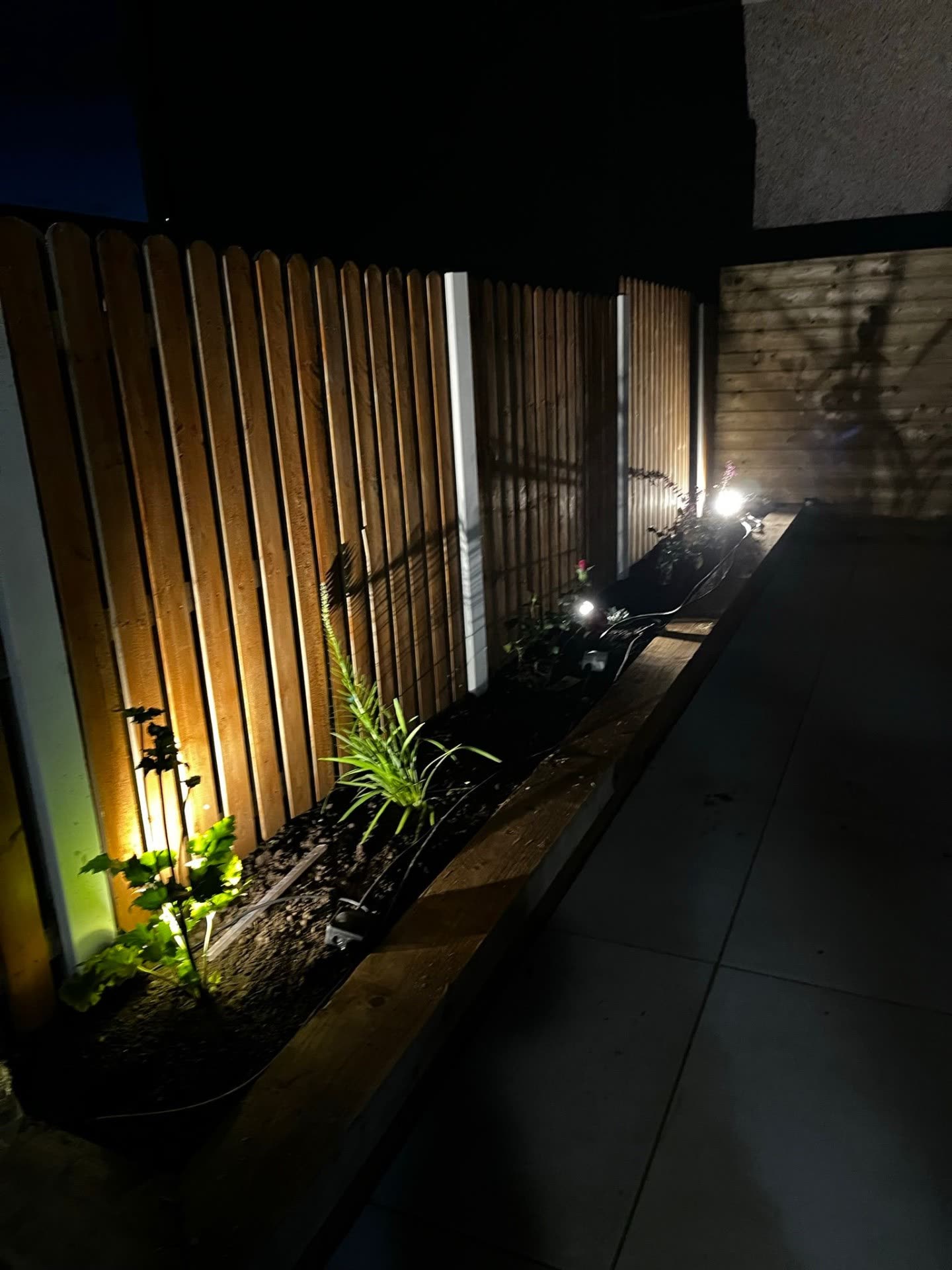 Garden planter fence lighting